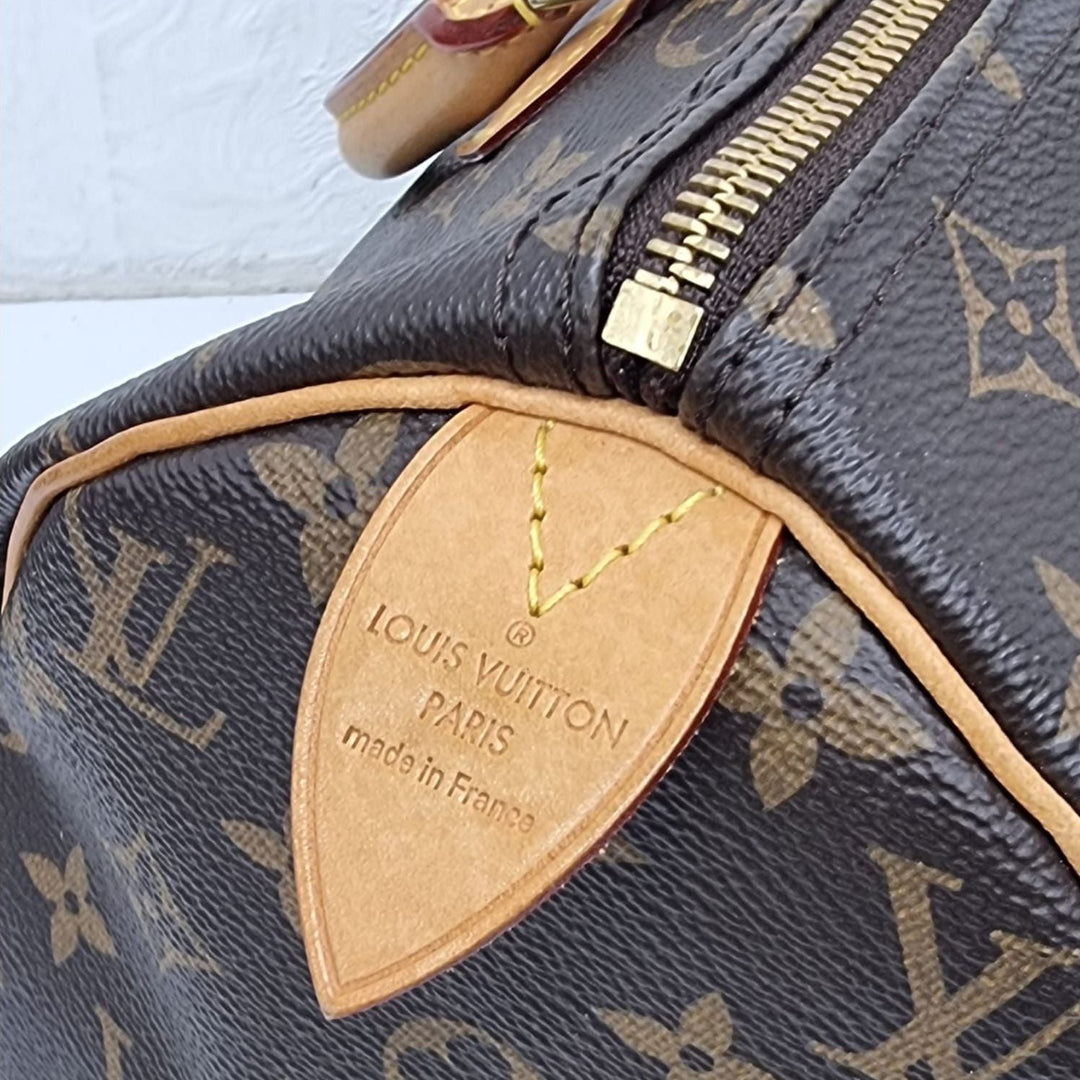 Pre loved Louis Vuitton Speedy 30 Monogram. Graded "Very Good". 