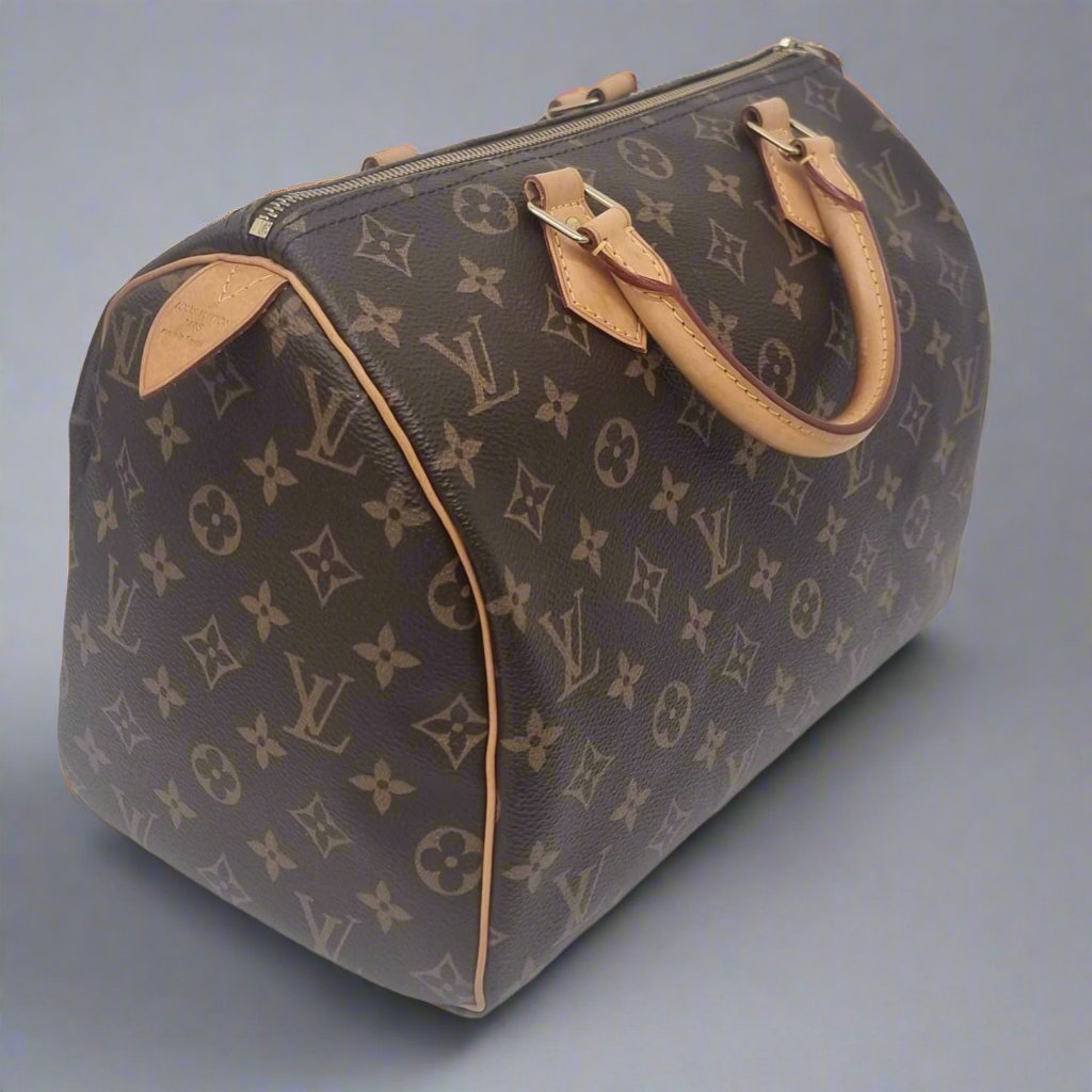 Pre loved Louis Vuitton Speedy 30 Monogram. Graded "Very Good". 